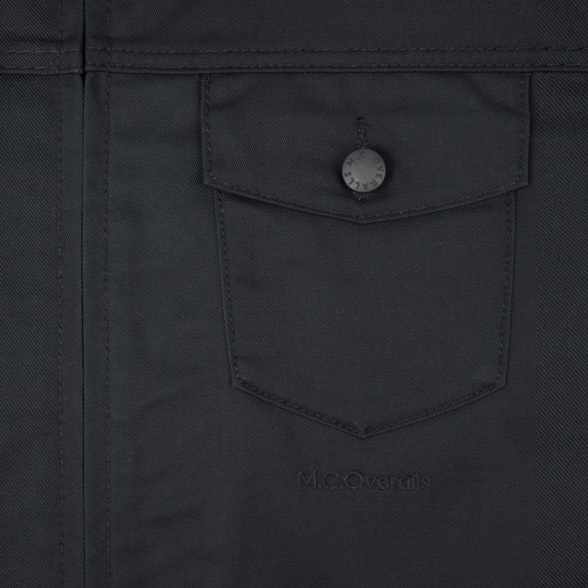 Premium Pockets of Black Workwear Overalls in Soho, London, UK.
