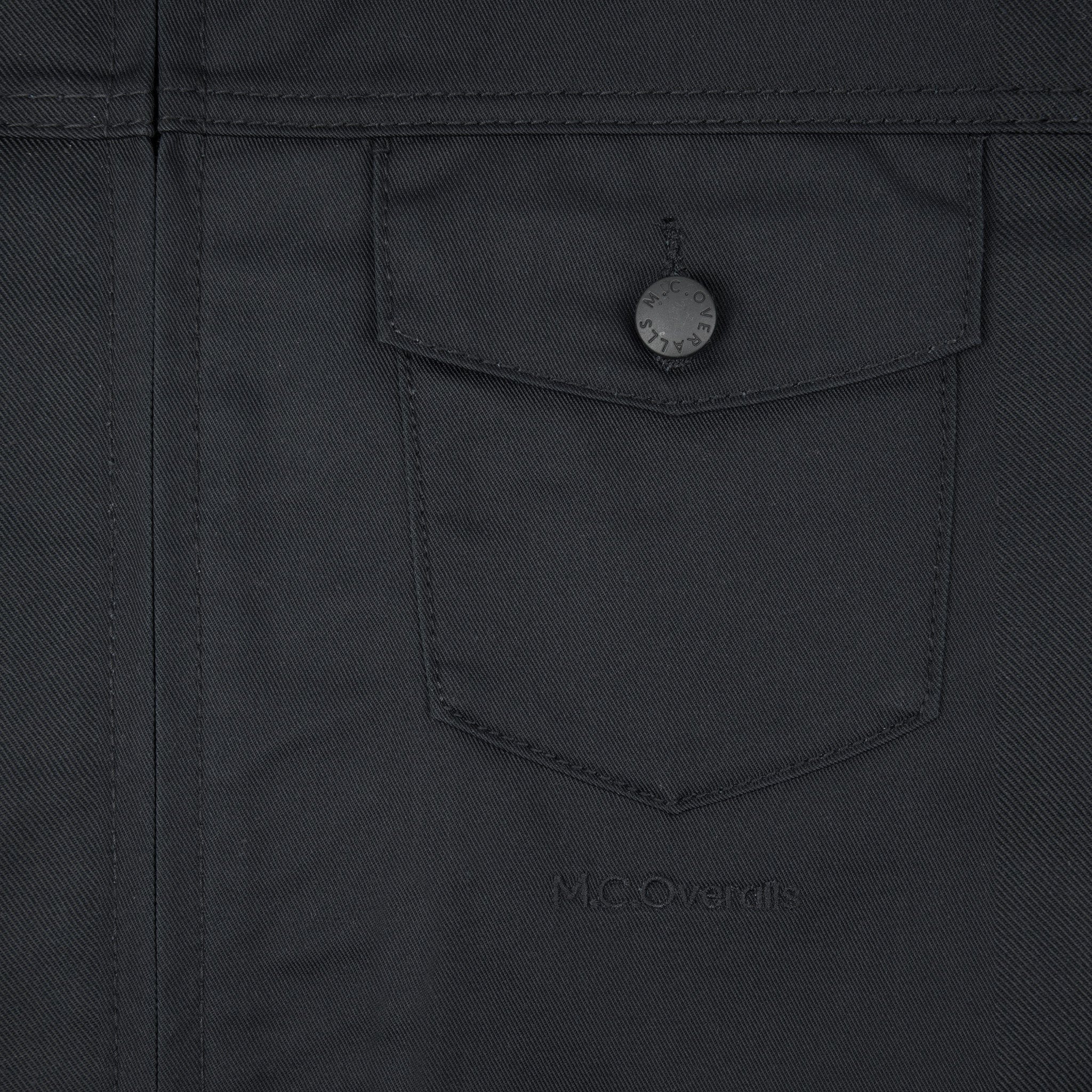 Premium Pockets of Black Workwear Overalls in Soho, London, UK.