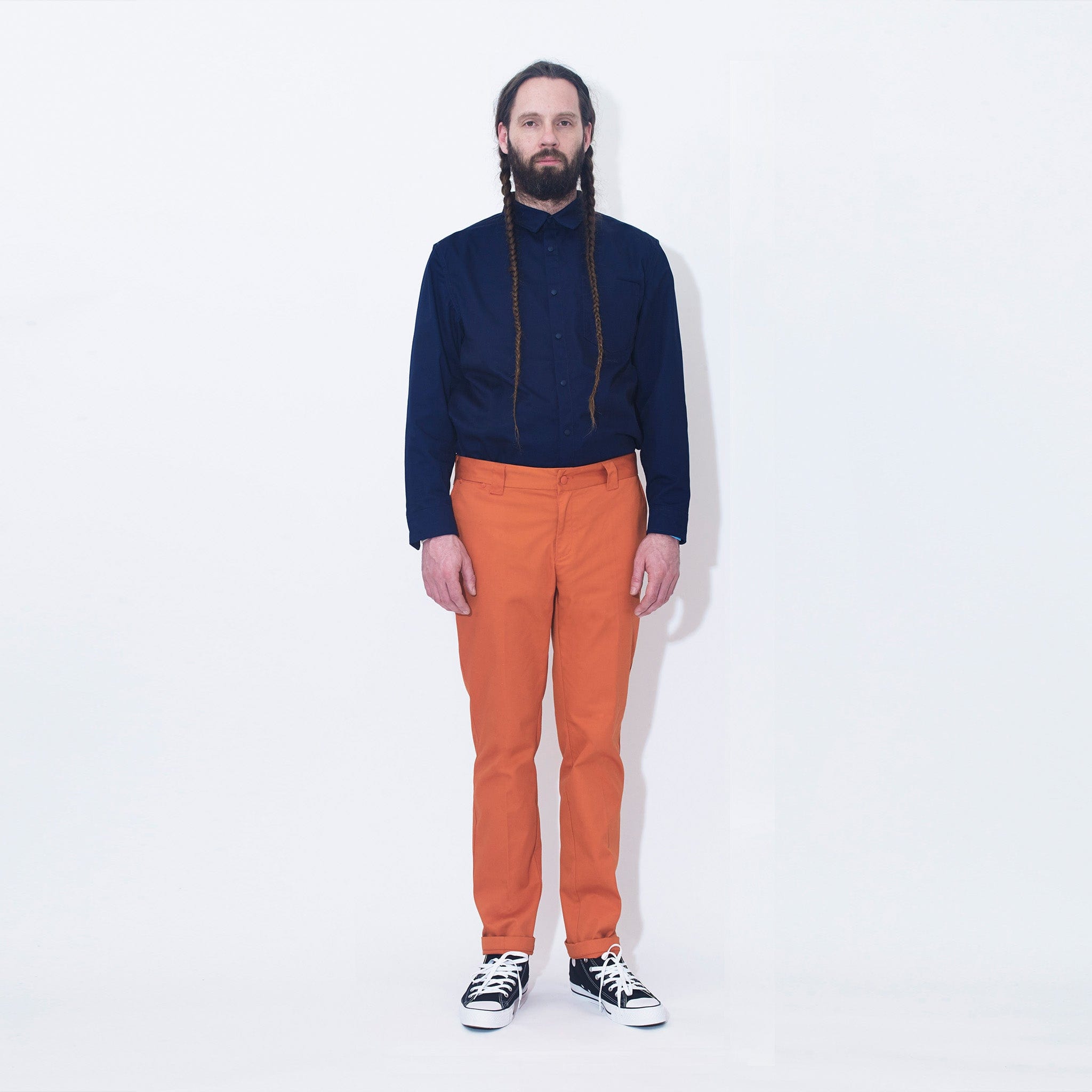 M.C.O's Navy Blue Snap Shirt Paired With Orange Work Trousers.
