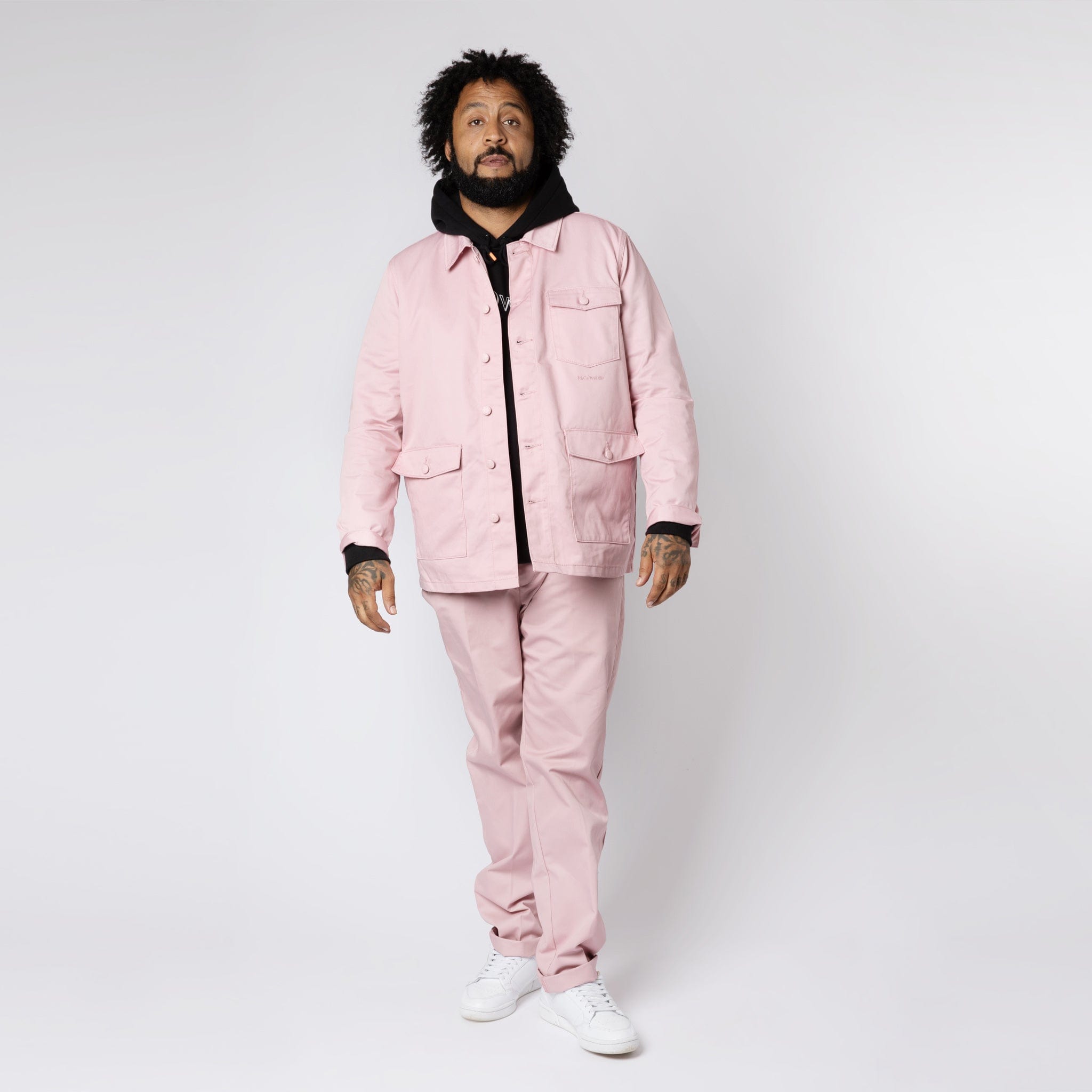 Men's Dusty Pink Work Jacket Styled With Black Logo Hoodie in London, UK.